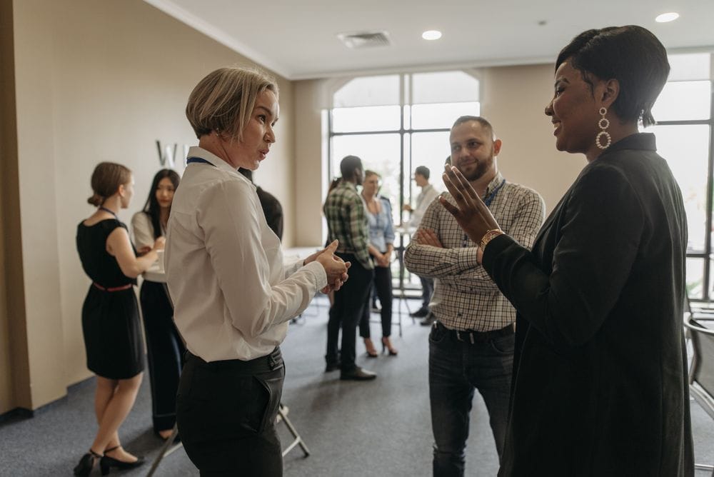 People talking at a networking event in Leeds
